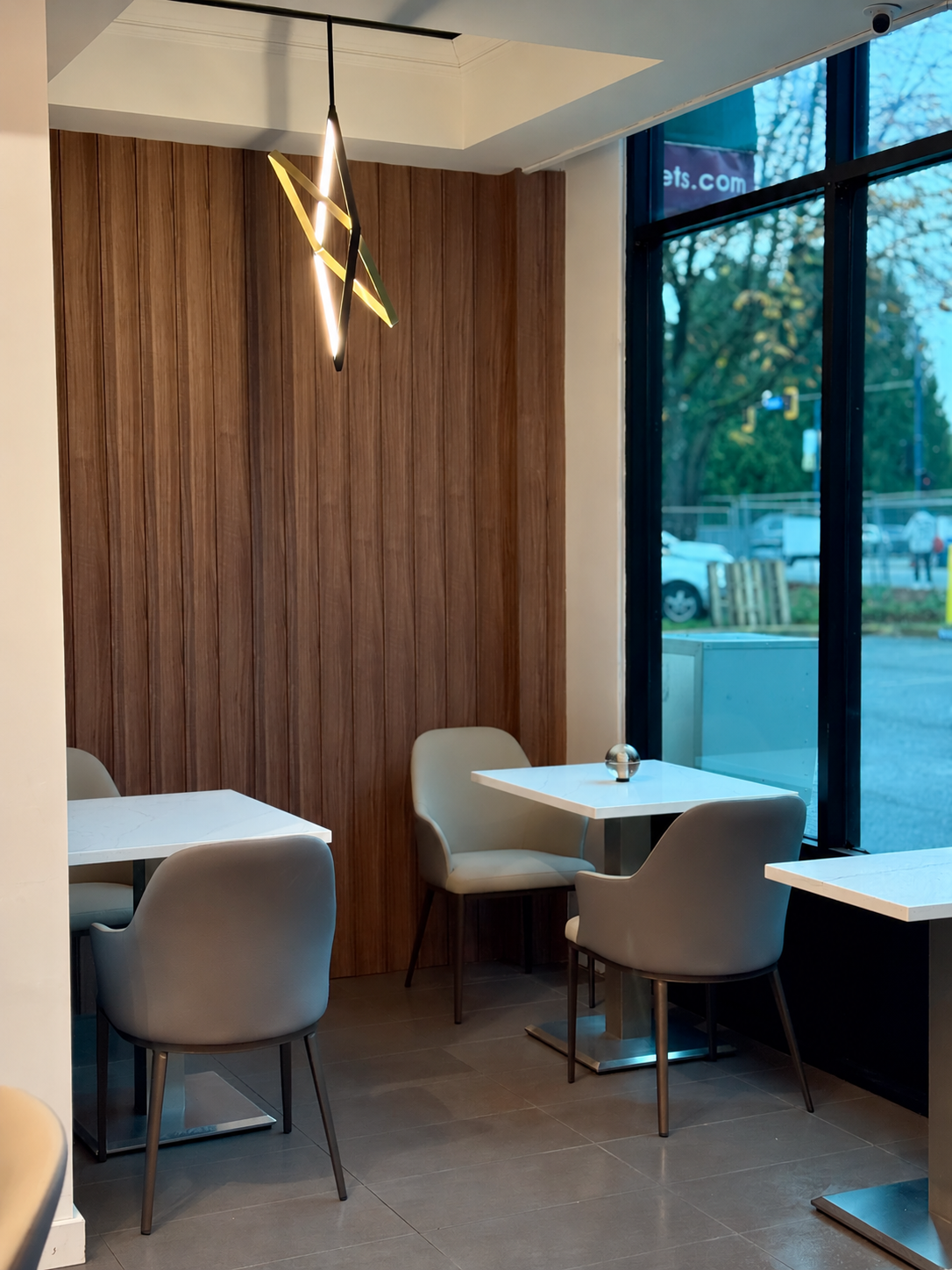 Warm wood panelling and comfortable seating by the bakery window